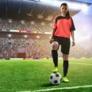 Female,Football,Player,In,Red,Uniform,On,Soccer,Field